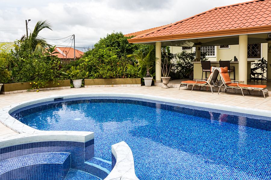 Professional pool inspector conducting a thorough pool inspection