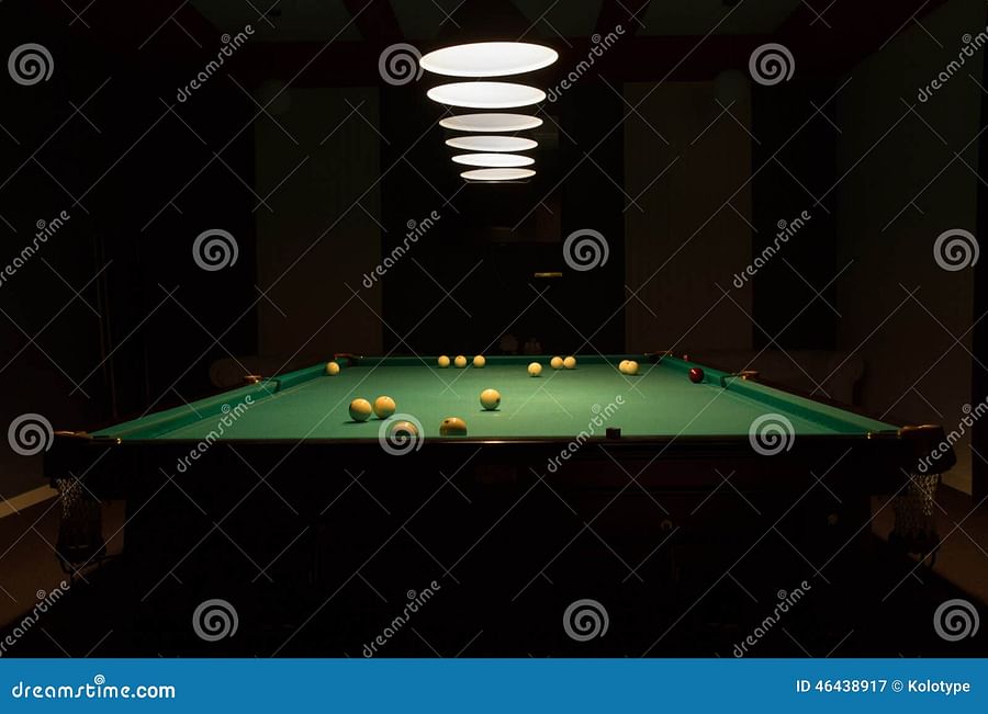 Dimly lit swimming pool at night emphasizing the importance of pool lighting