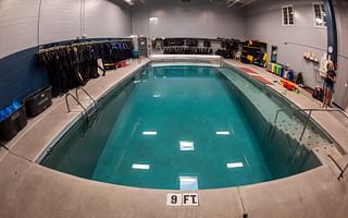 How can regular pool inspections contribute to the longevity of a swimming pool?